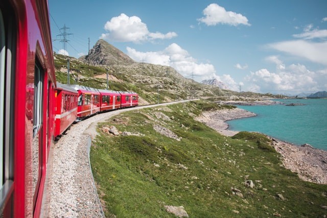 The Bernina Express train running through the swiss alps