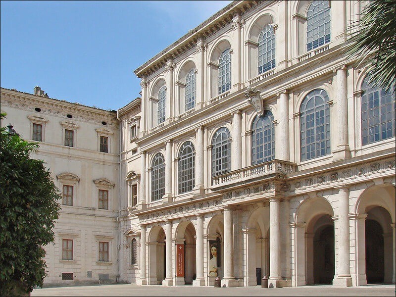 large white art gallery building with pillars and huge windows