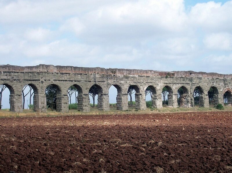 aqueducts park with arch walls and brown soil hidden gems in rome